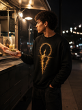 The Afterimage Sweatshirt worn at a nighttime food truck, featuring a large distorted gold reflection graphic on a black crewneck.
