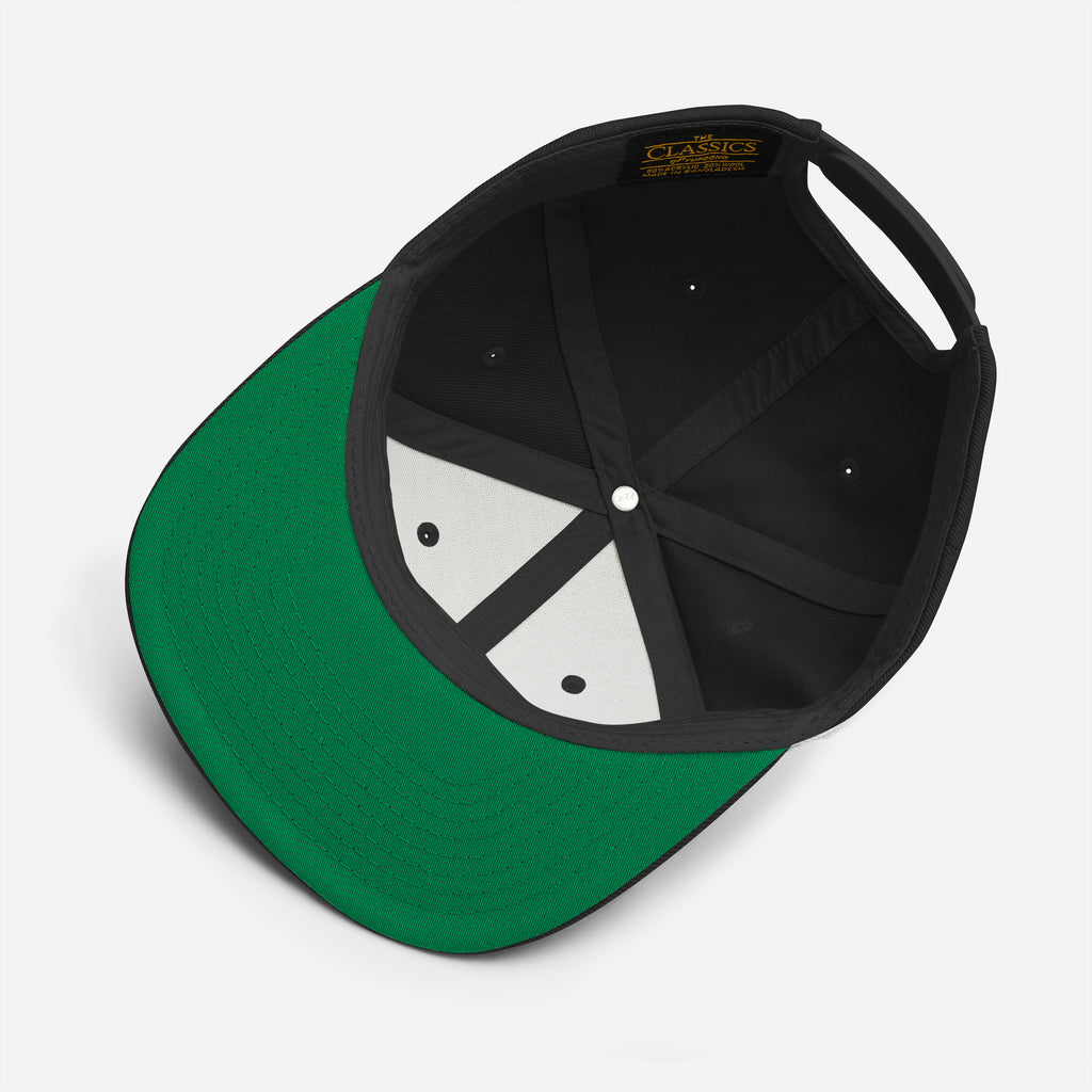 Interior view of The Suspension Cap showing the green undervisor, structured crown, and adjustable snapback closure.