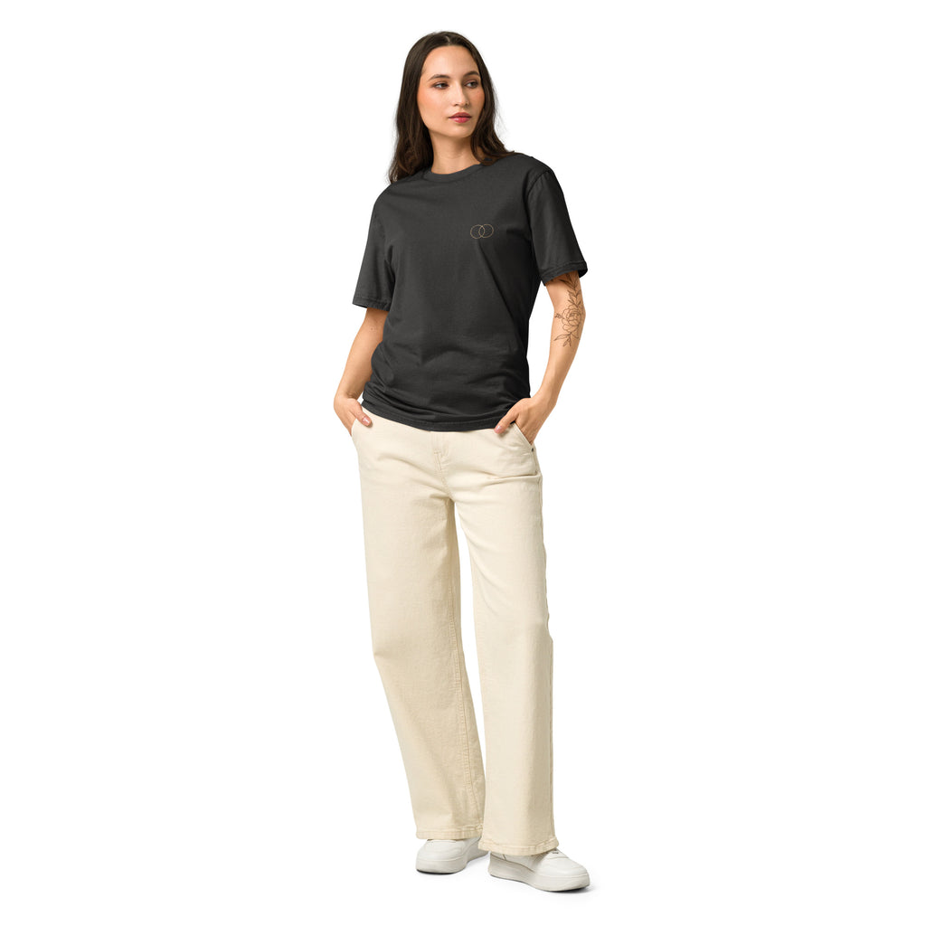 Woman wearing the EVAREN The Other Version Tee from the front, showing the relaxed fit and overlapping-circle chest mark.