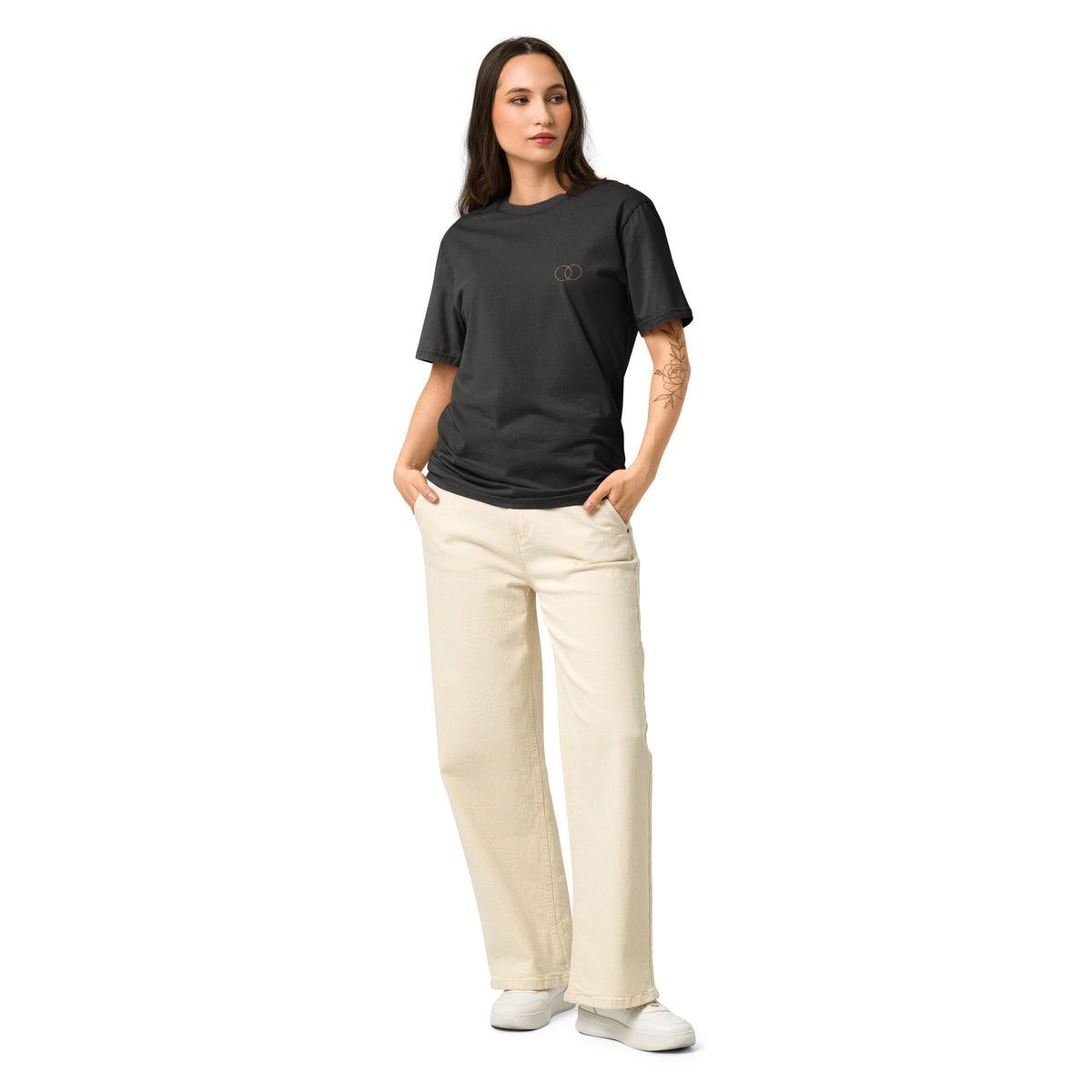 Woman wearing the EVAREN The Other Version Tee from the front, showing the relaxed fit and overlapping-circle chest mark.