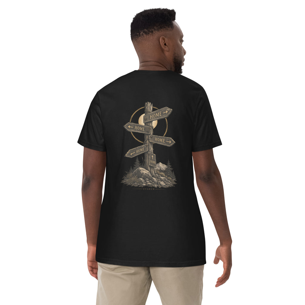Man wearing The Way Home Tee by EVAREN, showing the HOME signpost graphic centered on the back of the black T-shirt.