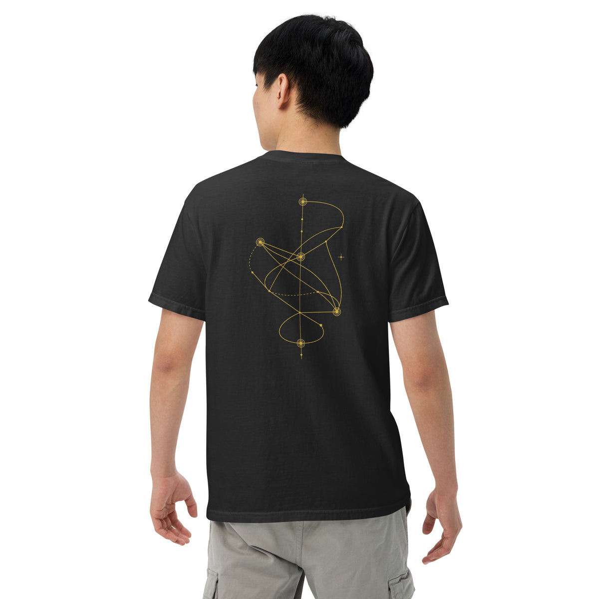 Model wearing The Nonlinear Tee in black, showing the gold nonlinear path graphic on the back.
