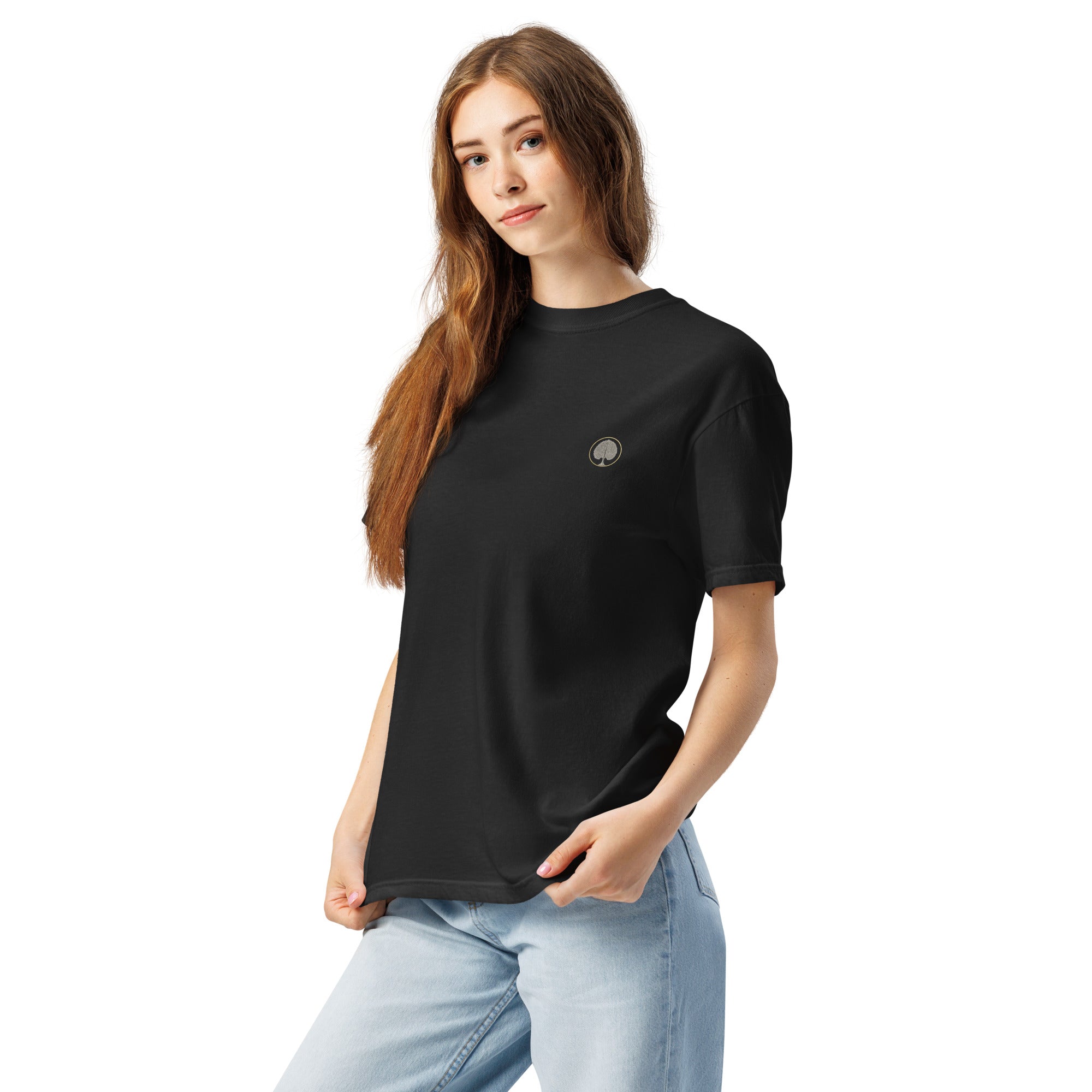 Model wearing the black EVAREN Control Room Tee, showing its relaxed fit and small left-chest tree emblem.