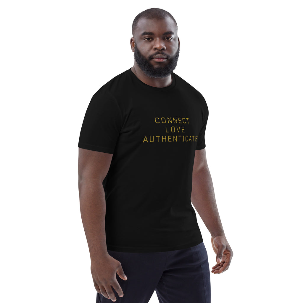 Man wearing The Human Protocol Tee in black, showing the front graphic placement and regular unisex fit.