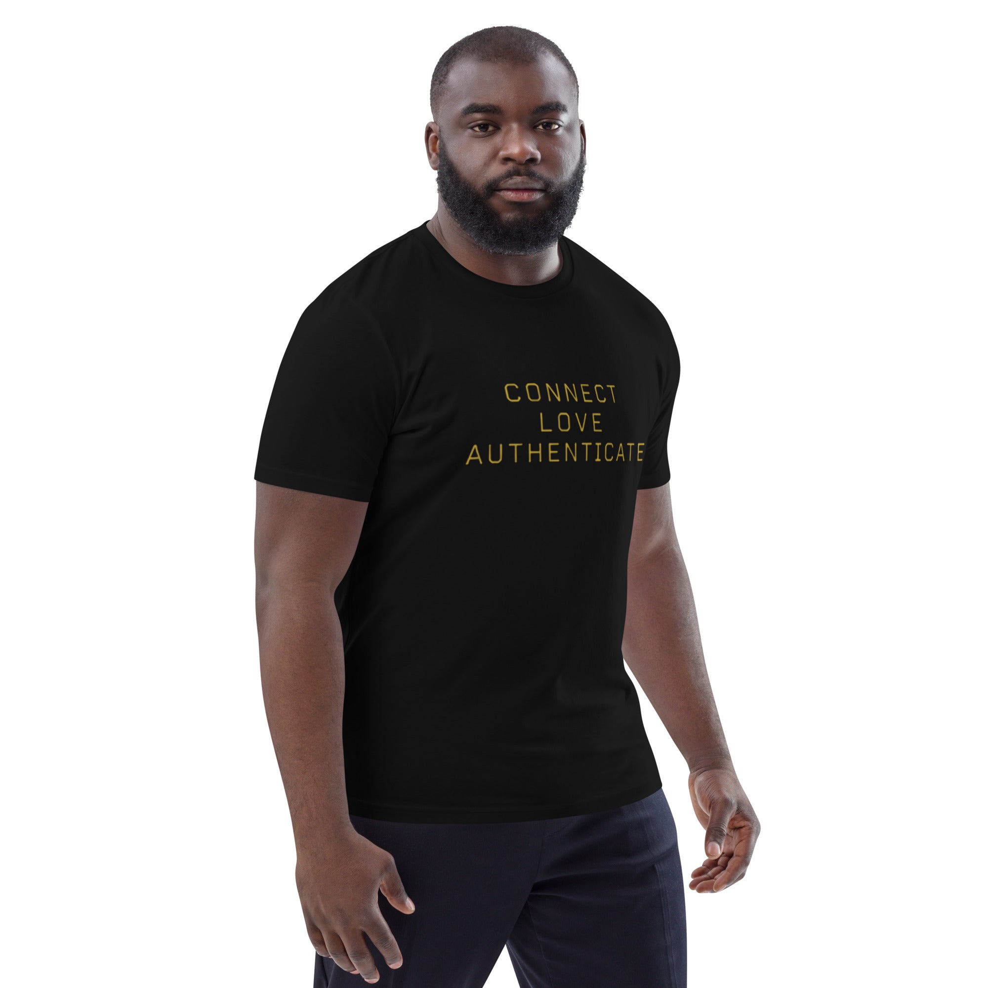 Man wearing The Human Protocol Tee in black, showing the front graphic placement and regular unisex fit.