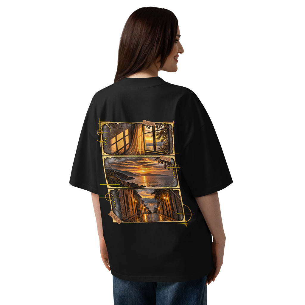 Woman wearing the black EVAREN Out of Frame Tee from behind, showing the oversized fit and three-frame large back artwork.