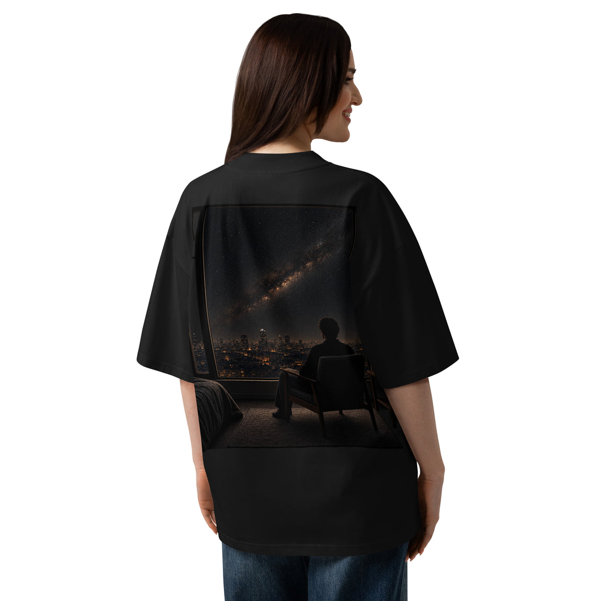 The Ordinary Sky Tee worn from the back, showing the oversized fit and large back artwork on a female model.