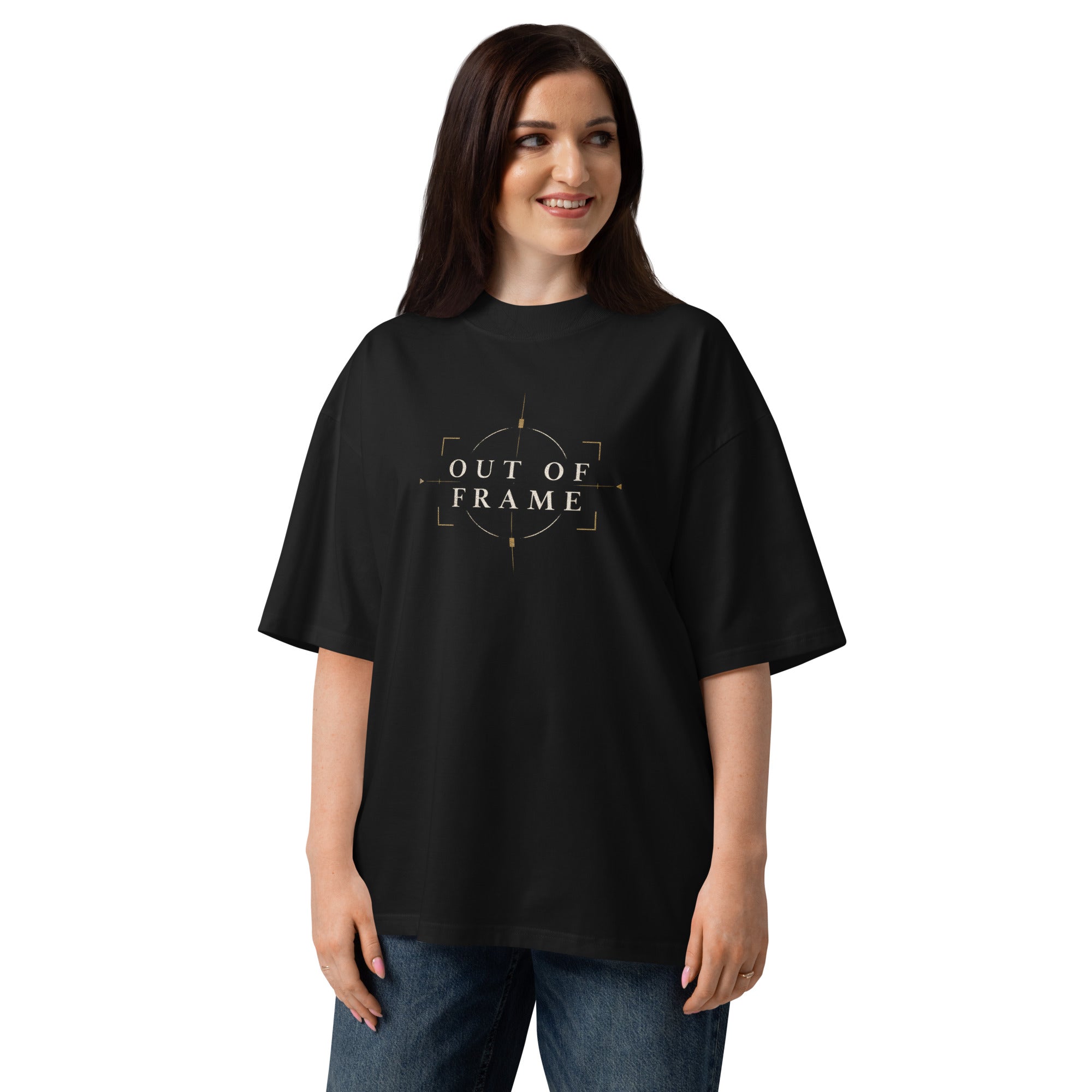 Woman wearing the black EVAREN Out of Frame Tee from the front, showing the oversized fit and centered chest artwork.
