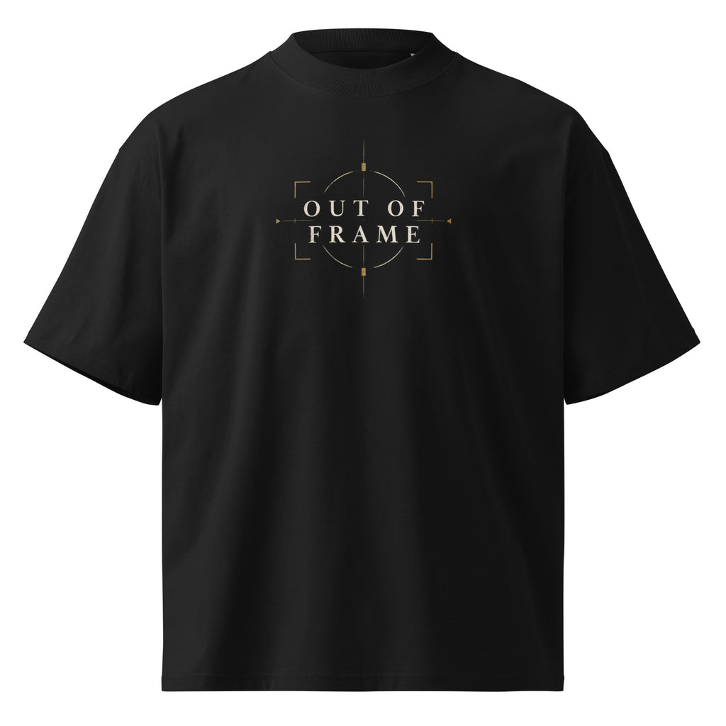 Front view of the black EVAREN Out of Frame Tee with centered OUT OF FRAME artwork in muted gold and cream.