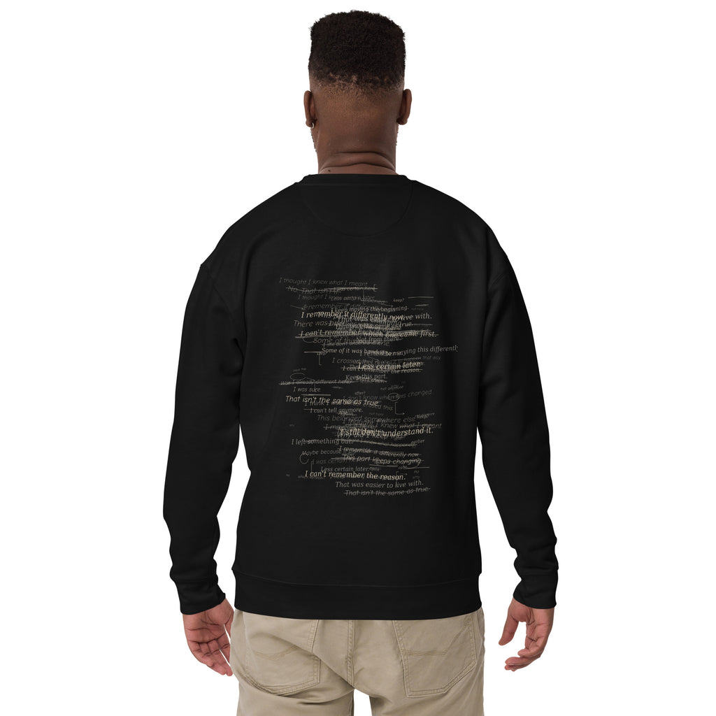 Model wearing The Palimpsest Sweatshirt in black, showing the layered handwritten back artwork and print placement.