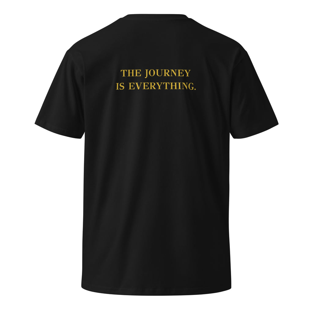 Black EVAREN The Journey Is Everything Tee, back view, featuring “THE JOURNEY IS EVERYTHING.” in muted gold lettering.