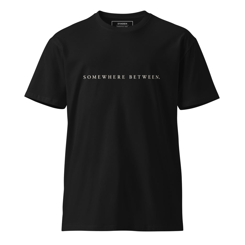 Front of black EVAREN Somewhere Between Tee with Somewhere Between text across the chest