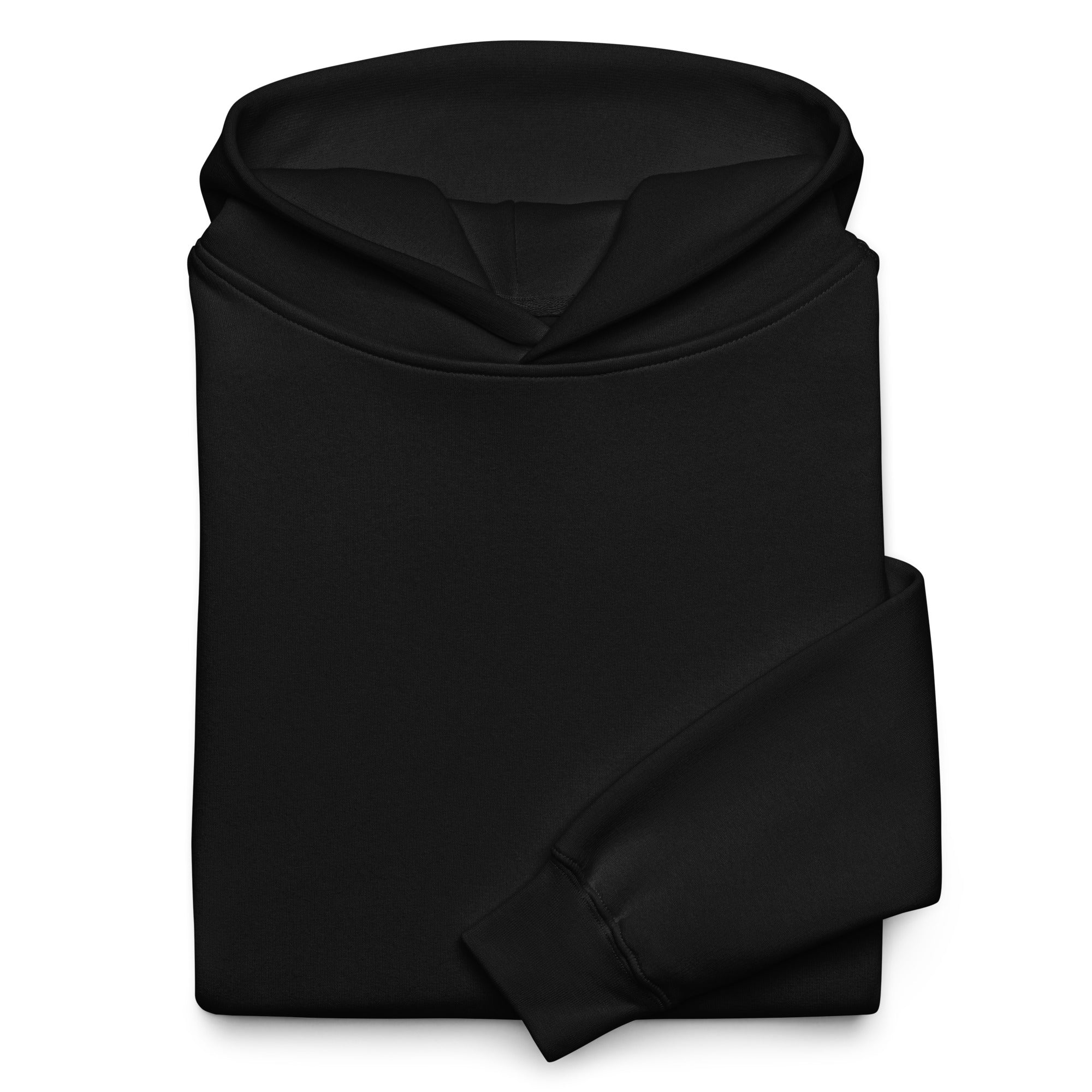 Folded black Distortion Hoodie by EVAREN showing the oversized hood, fabric, and ribbed cuff.