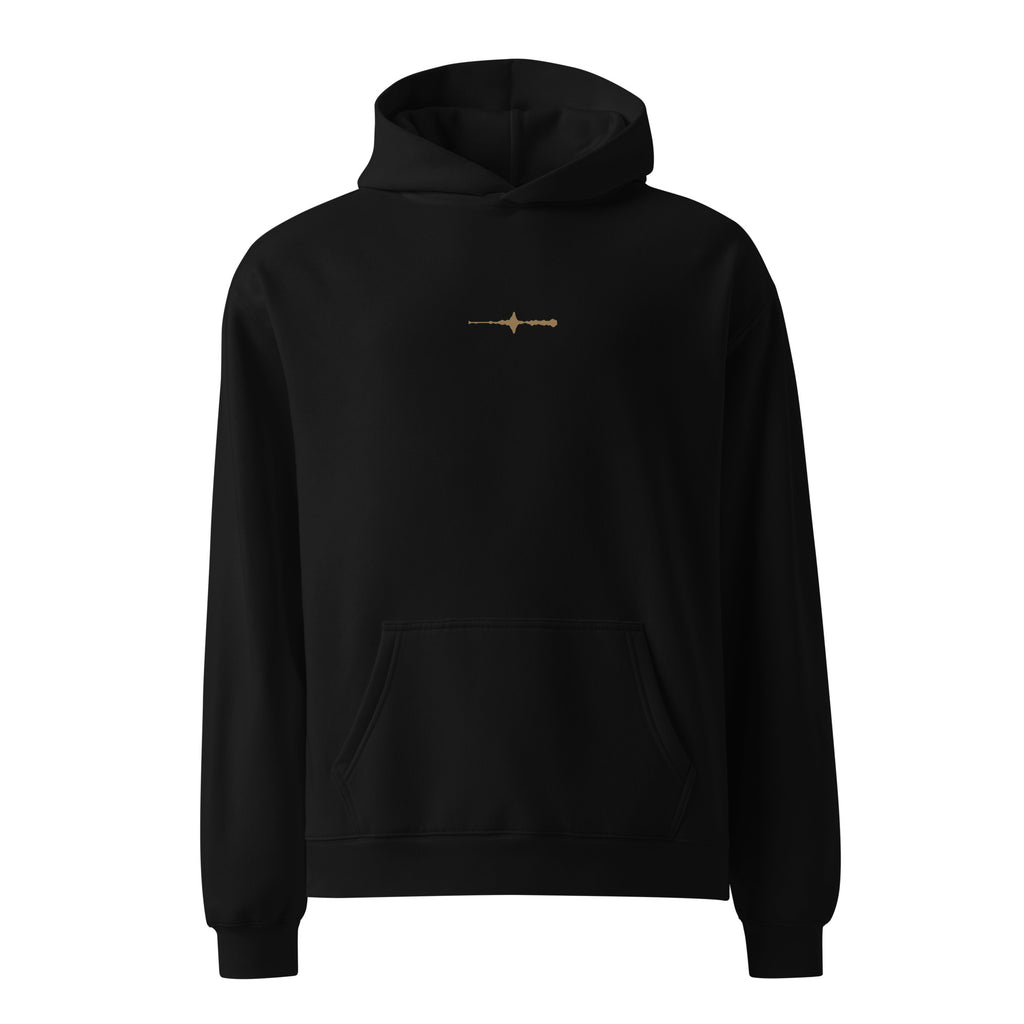 Front view of the black EVAREN Room Tone Hoodie with a small muted-gold waveform centered on the chest.