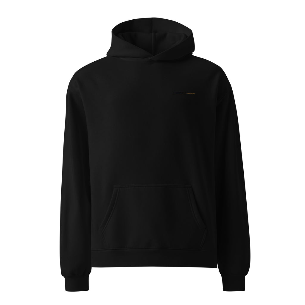Front view of The Break Hoodie in black with a restrained gold line detail on the chest.